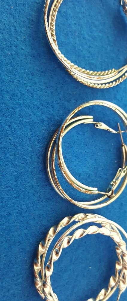 Set of three (3) Silver Tone hoop earings.